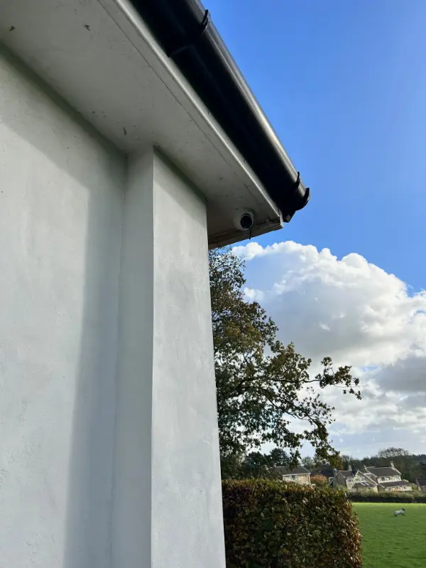 4K ultra HD security camera with clear daytime image quality showing a residential street