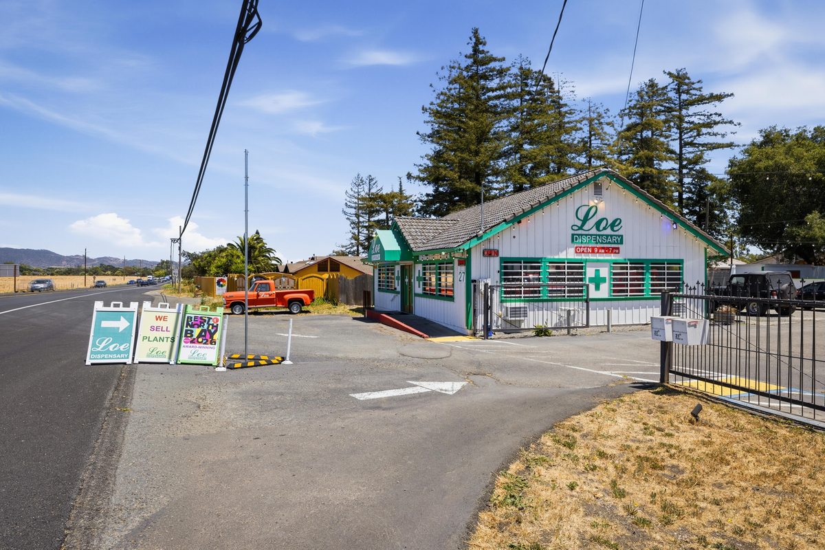 Dispensary exterior — street frontage with signage