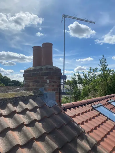 Weatherproof junction box protecting CCTV cable connections on an external wall