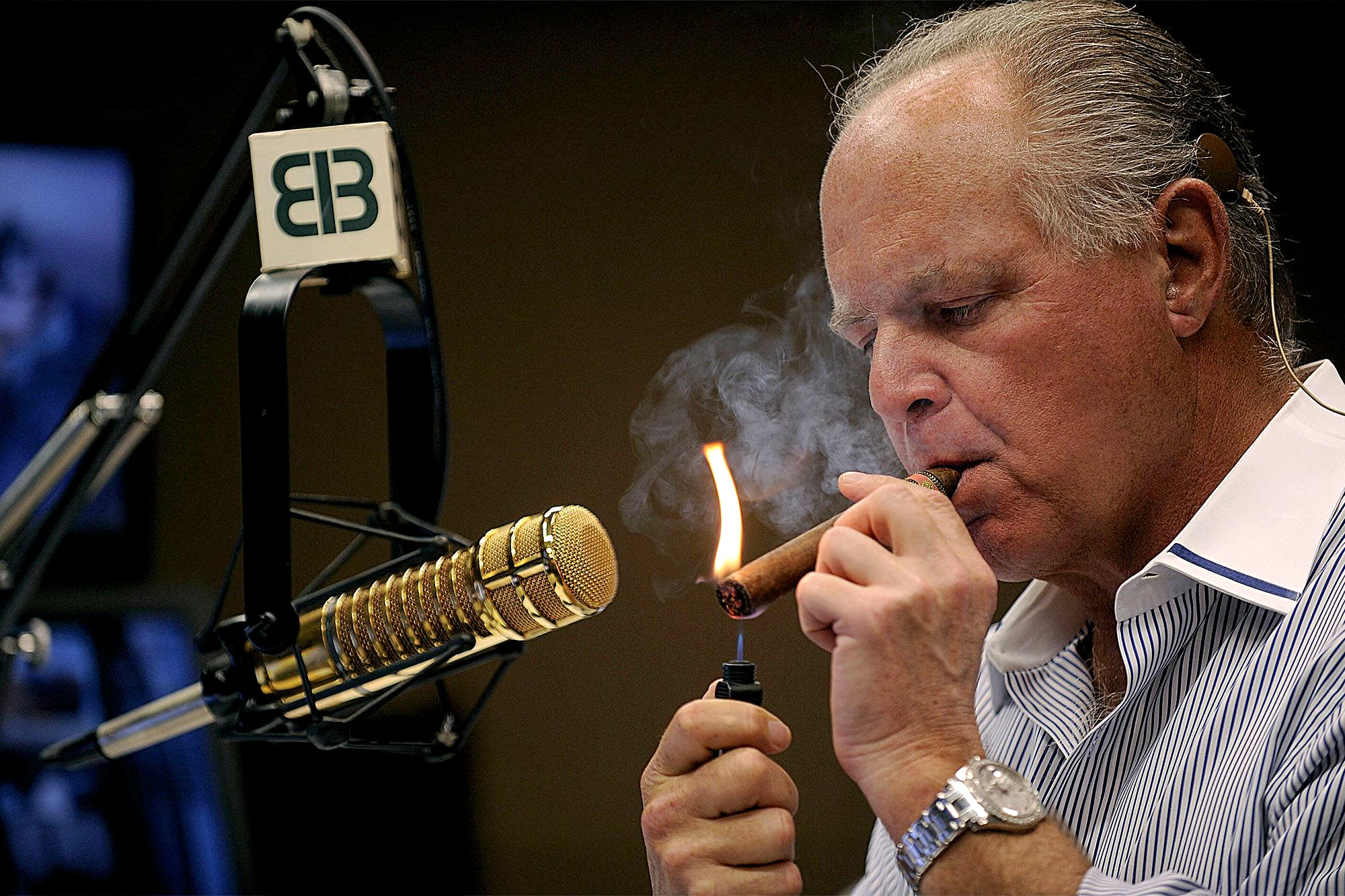 Rush Limbaugh smoking a cigar