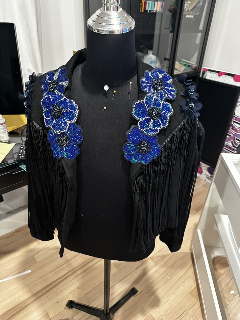 Beaded blue flowers on the jacket