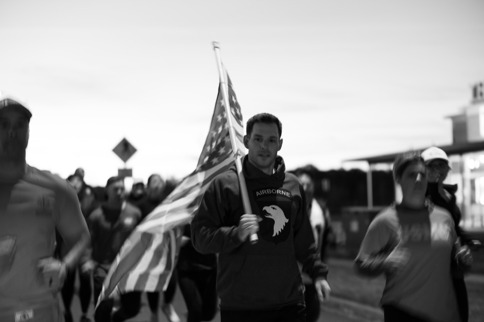 Group of runners with the American flag