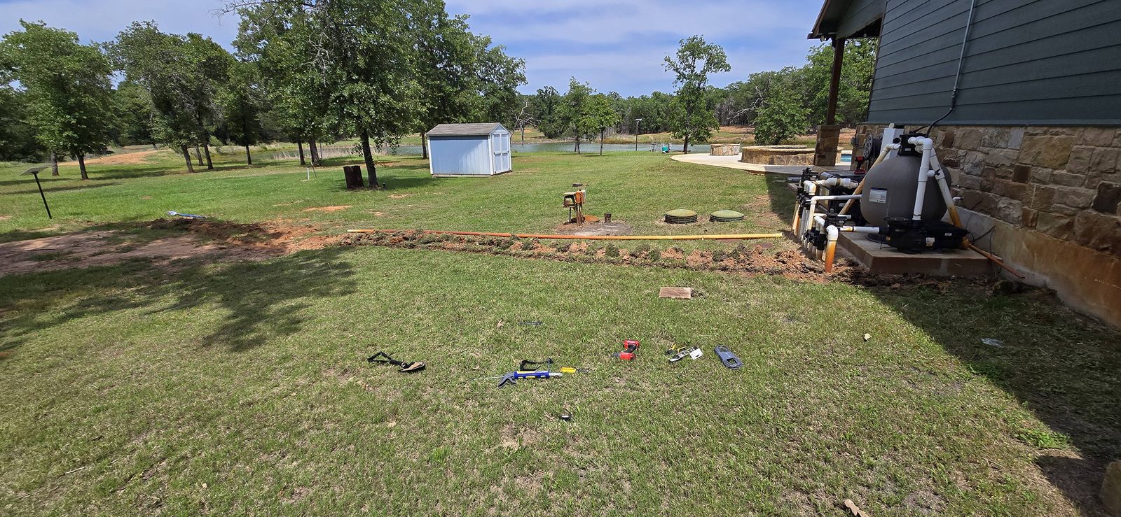 Outdoor conduit run along the house