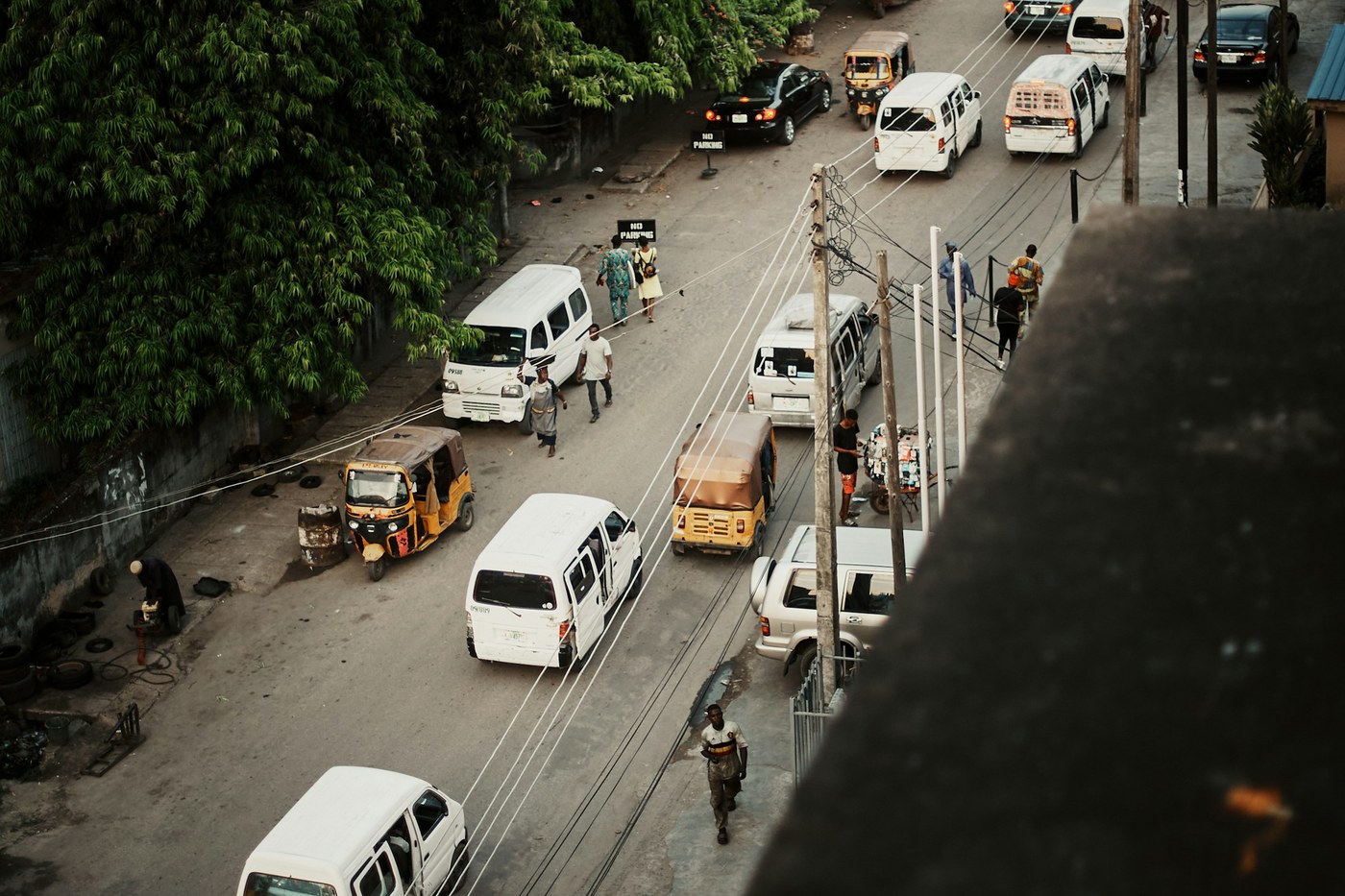 Traffic moves between high-rise buildings on a broad road in Lagos Island, Nigeria.