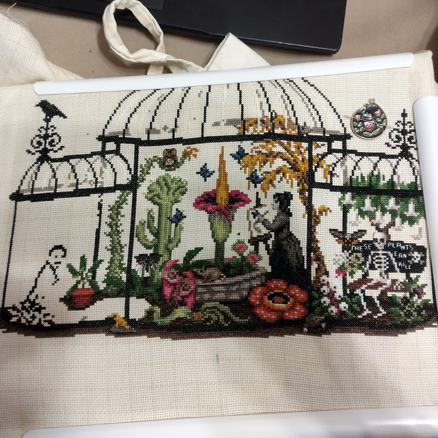 Greenhouse of Oddities cross stitch WIP