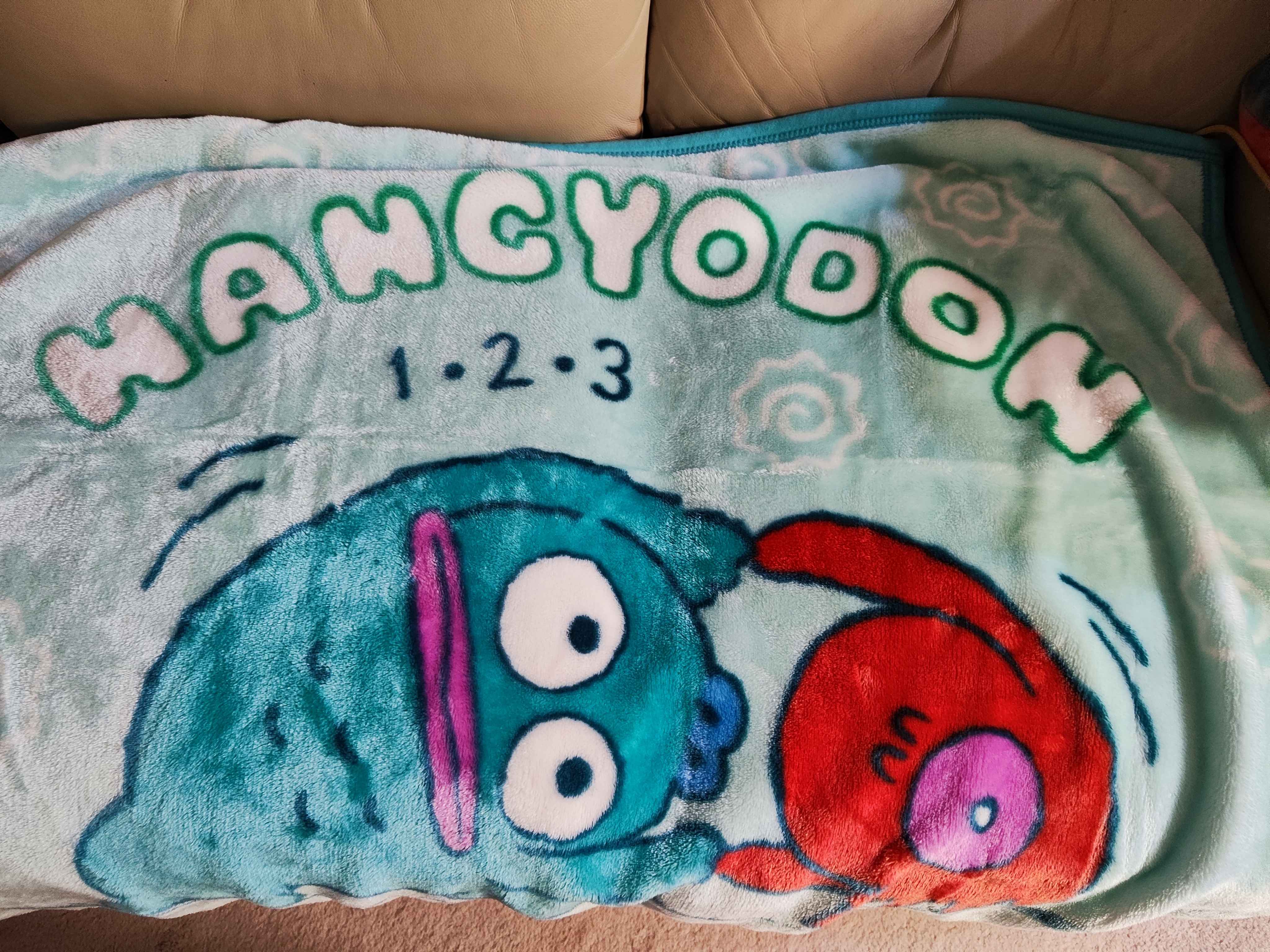 my useless hangyodon blanket that's soft but doesn't even cover my toes. i'm not even considered tall. at least he's cute