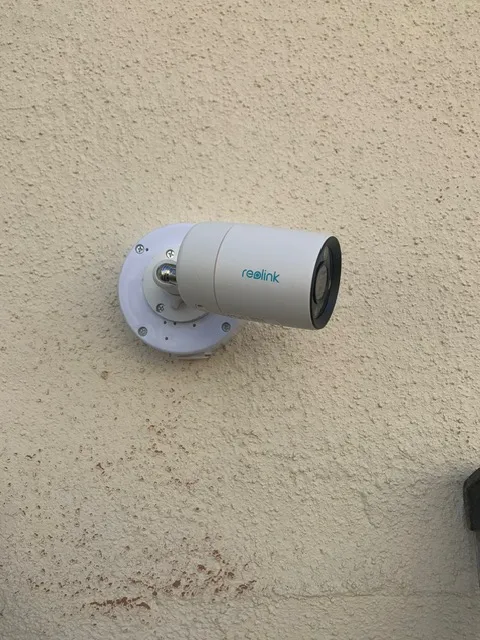 Indoor CCTV dome camera mounted on ceiling monitoring a commercial office space