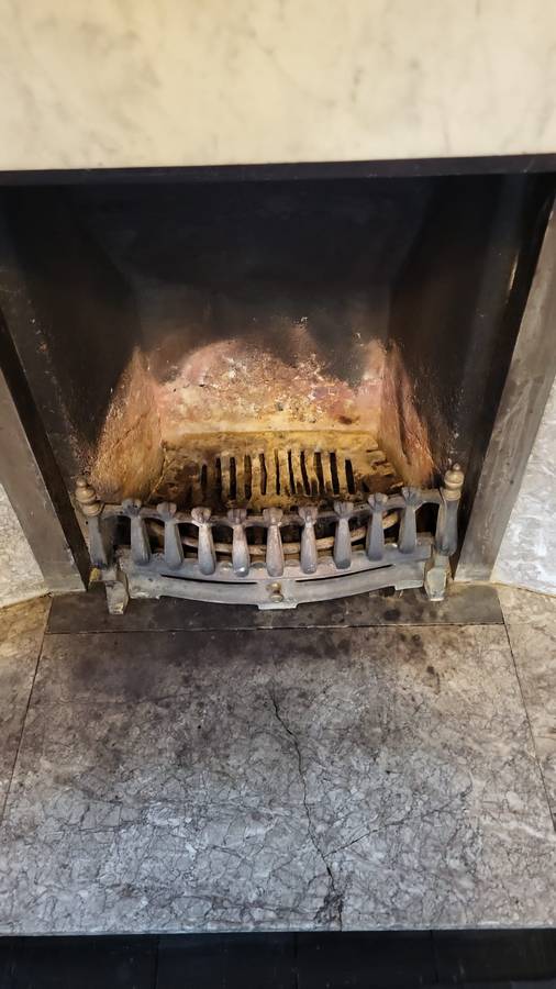 Chimney grate after sweeping, soot fully cleared
