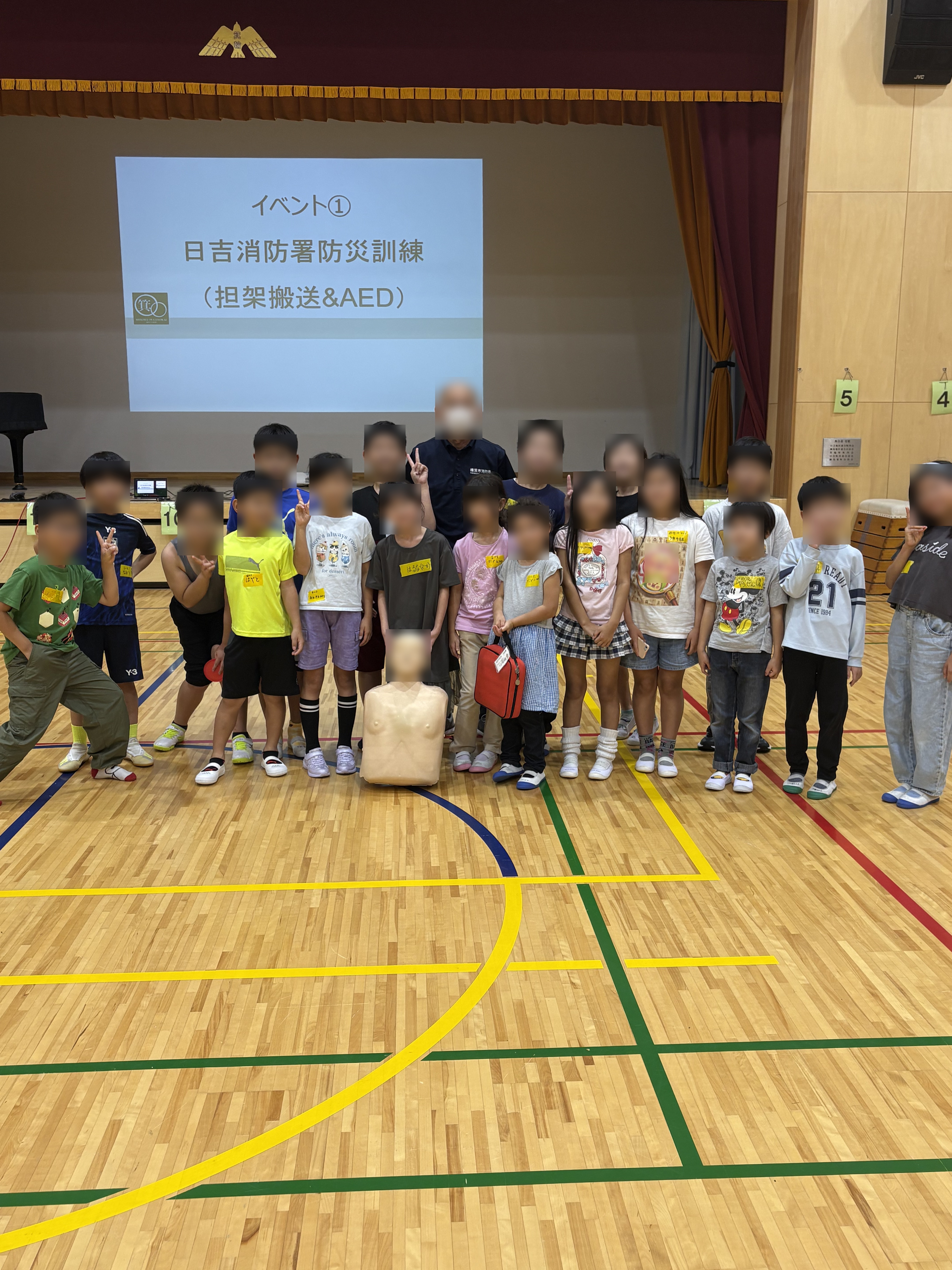 日吉消防署防災訓練のスライドと集合写真
