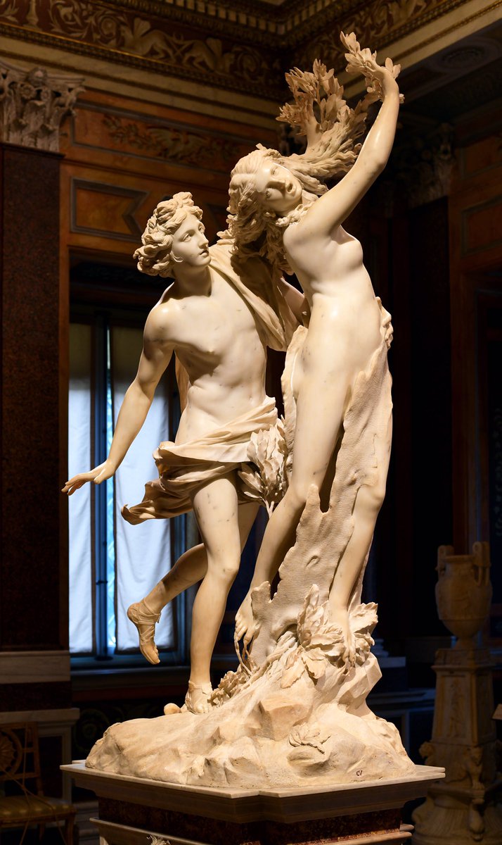 Two marble figures embrace as the second reaches her arms towards the heavens