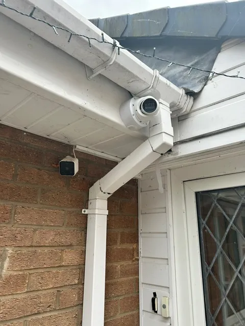 Security camera cabling and Ethernet cables running through a loft space during installation