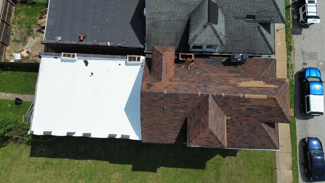 Roof replacement progress with old roof section visible