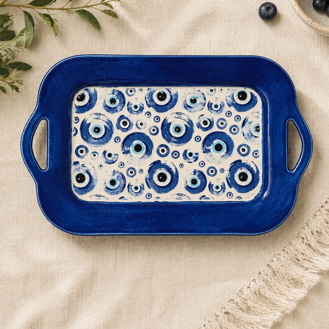 Hand-built tray with a hand-painted evil eye design.