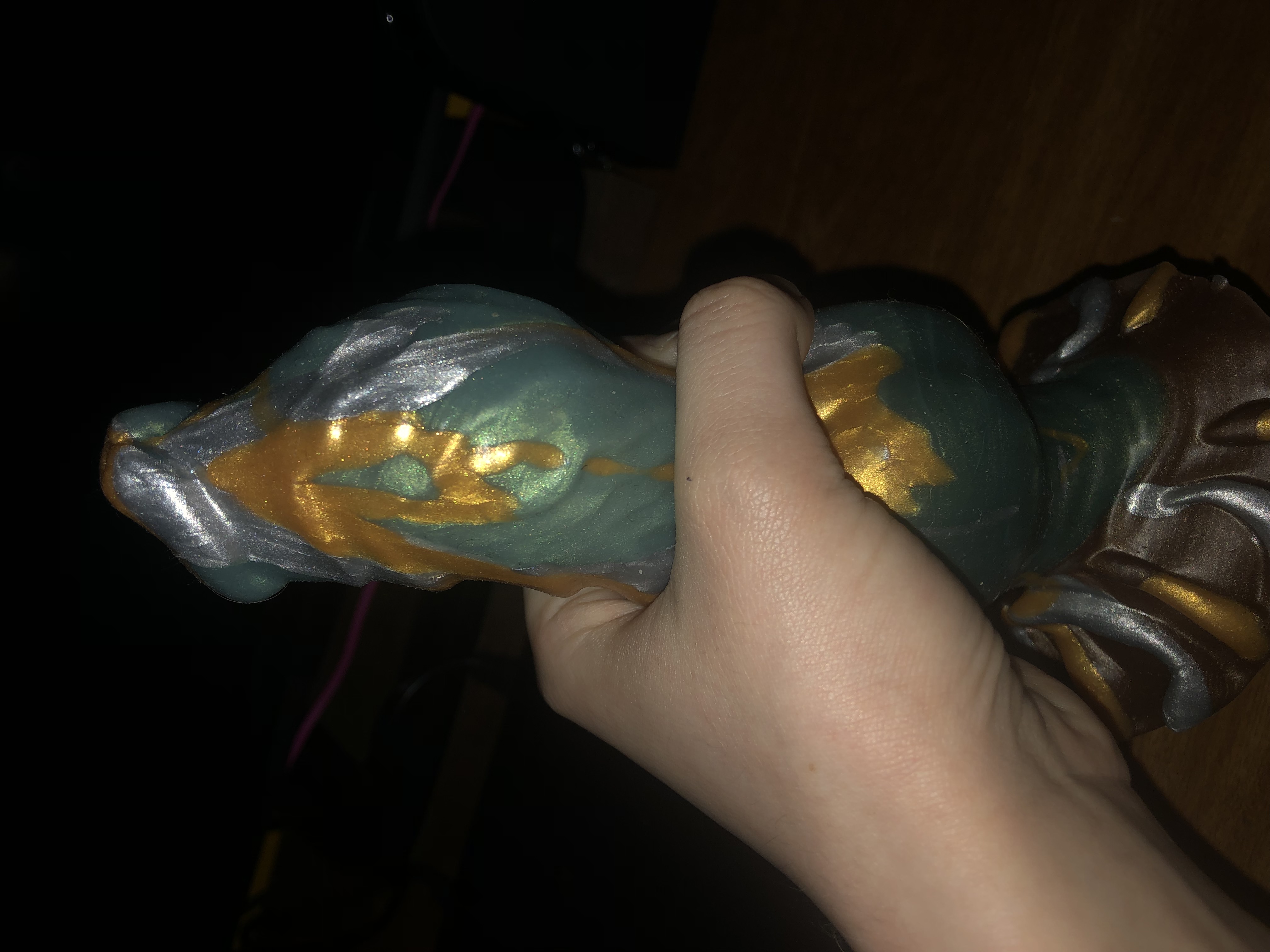 a view of ossium from the side with my hand around it