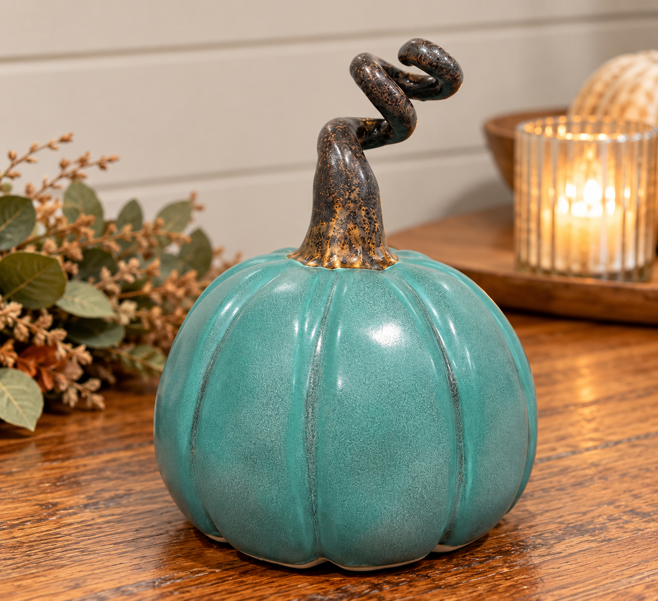 Hand-built one-of-a-kind pumpkin in a patina glaze.