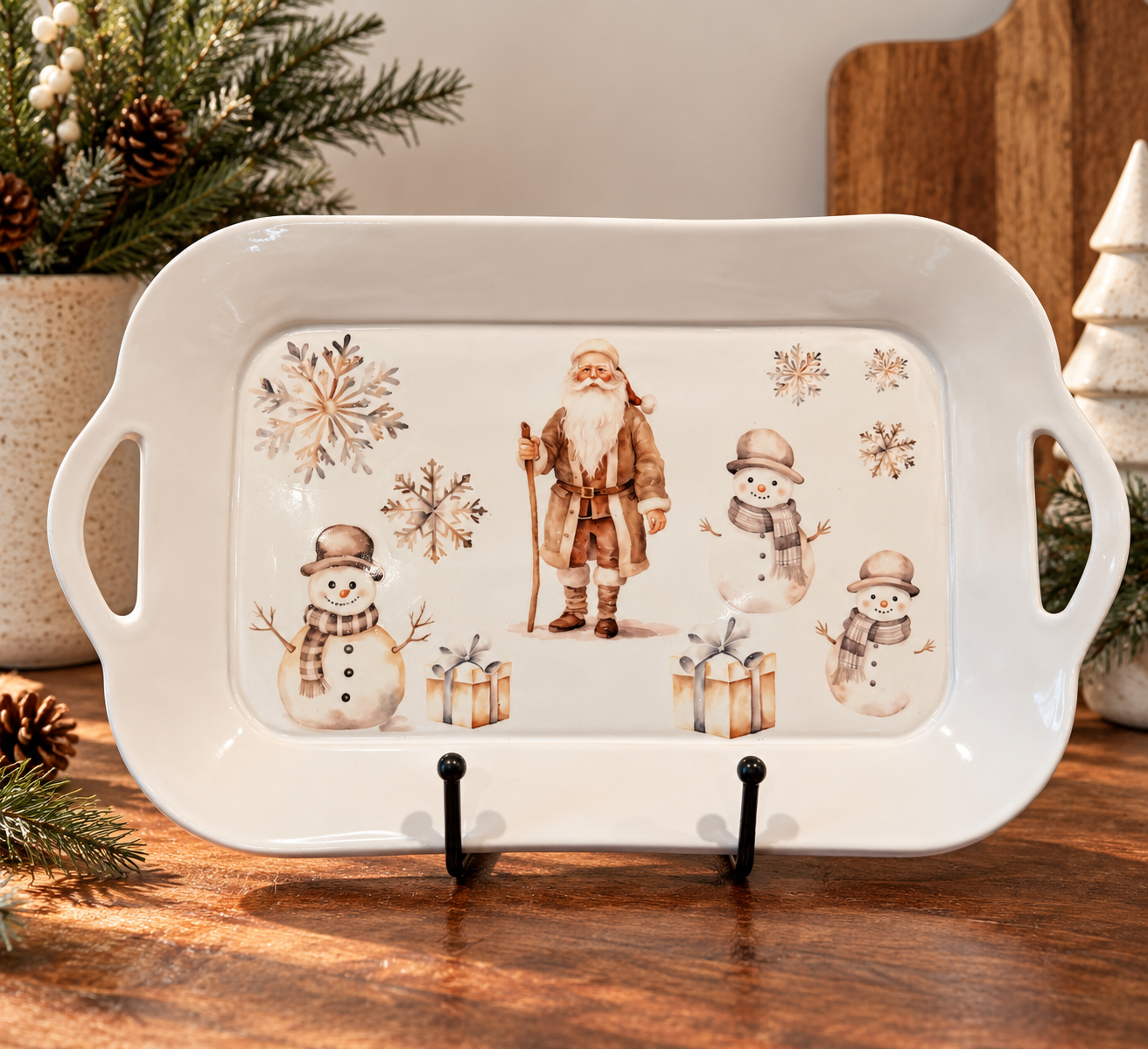 White rectangular hand-built tray with built-in side handles and a vintage-style Santa with snowmen in sepia tones
