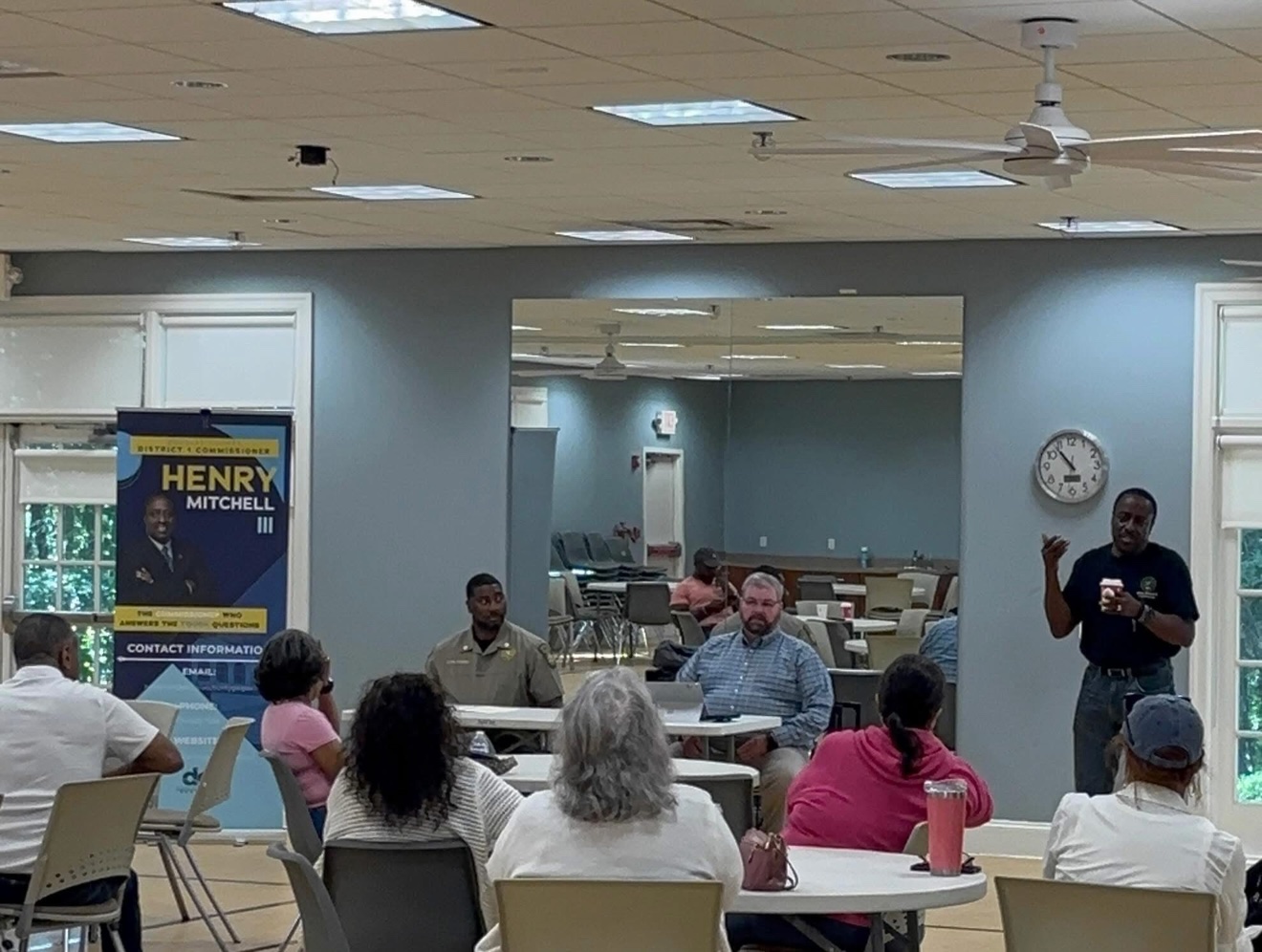 Commissioner Mitchell speaking with residents at a community town hall