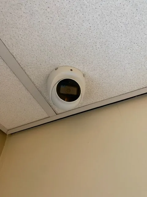 Infographic showing recommended CCTV camera placement positions around a UK property