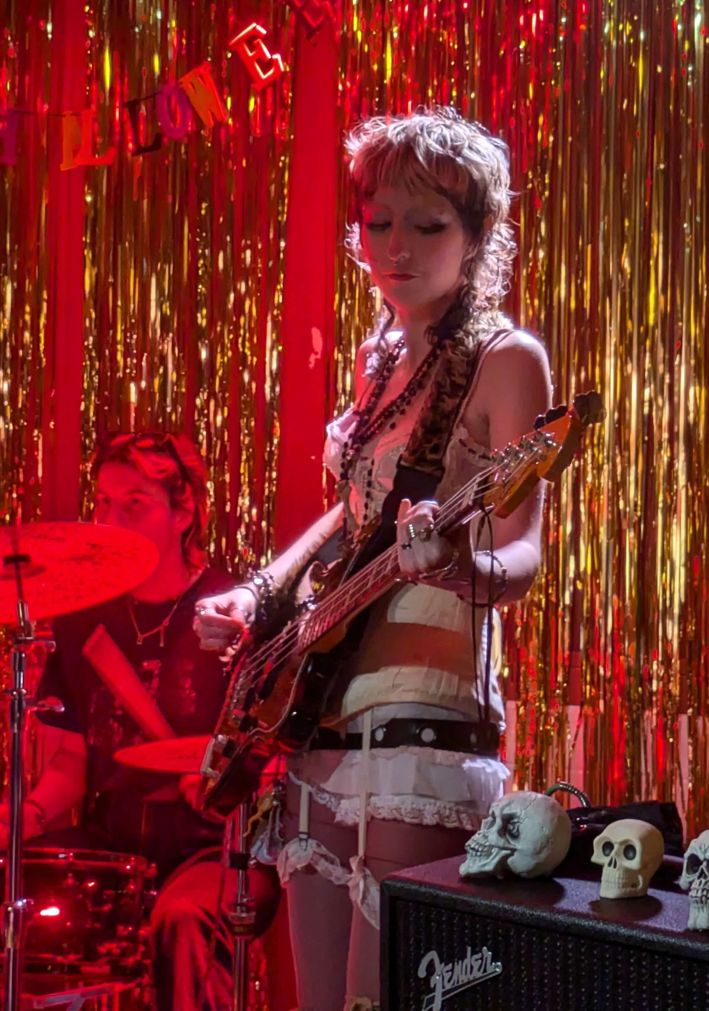 person playing bass guitar