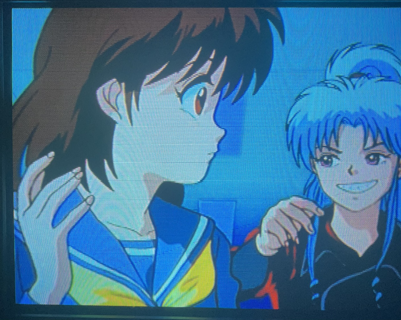 Botan looks at Keiko with a toothy grin while wearing a cool dark motorcycle jacket