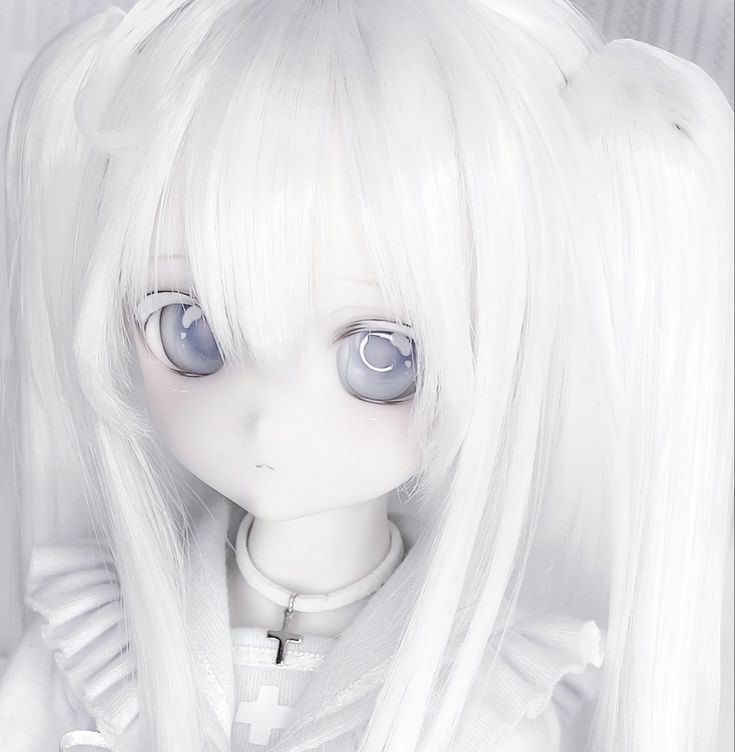 Anime doll girl headshot clad in all white, a cross around her neck. Milky blue eyes and a pensive smile