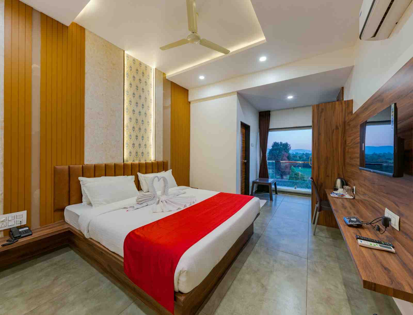 Actual guest room interior at Hotel Trisha Executive near Shri Sant Balumama Temple, Adamapur, Kolhapur; room category is shown in the card heading