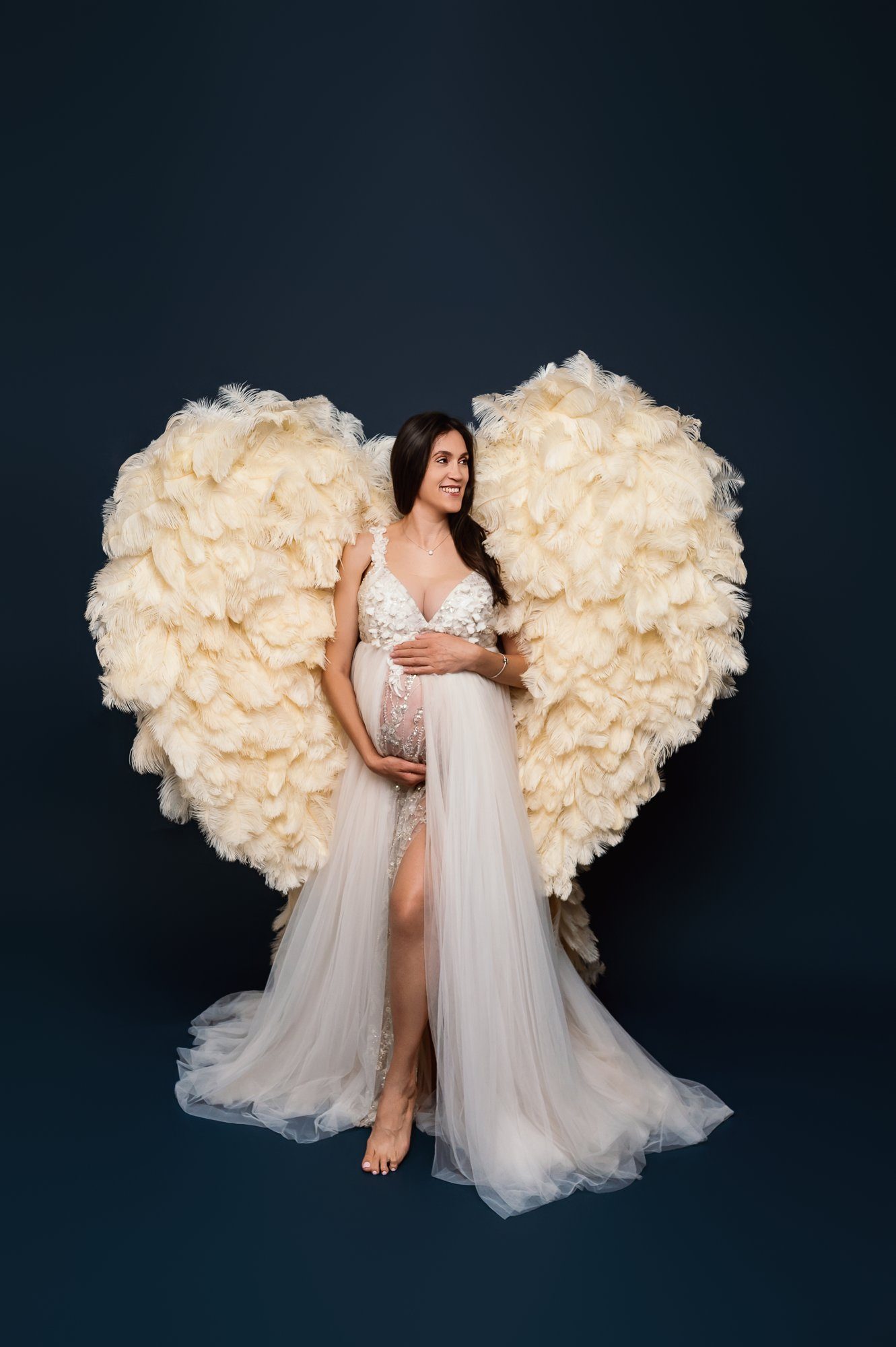 Professional maternity photography setup showing expecting couple's connection and joy