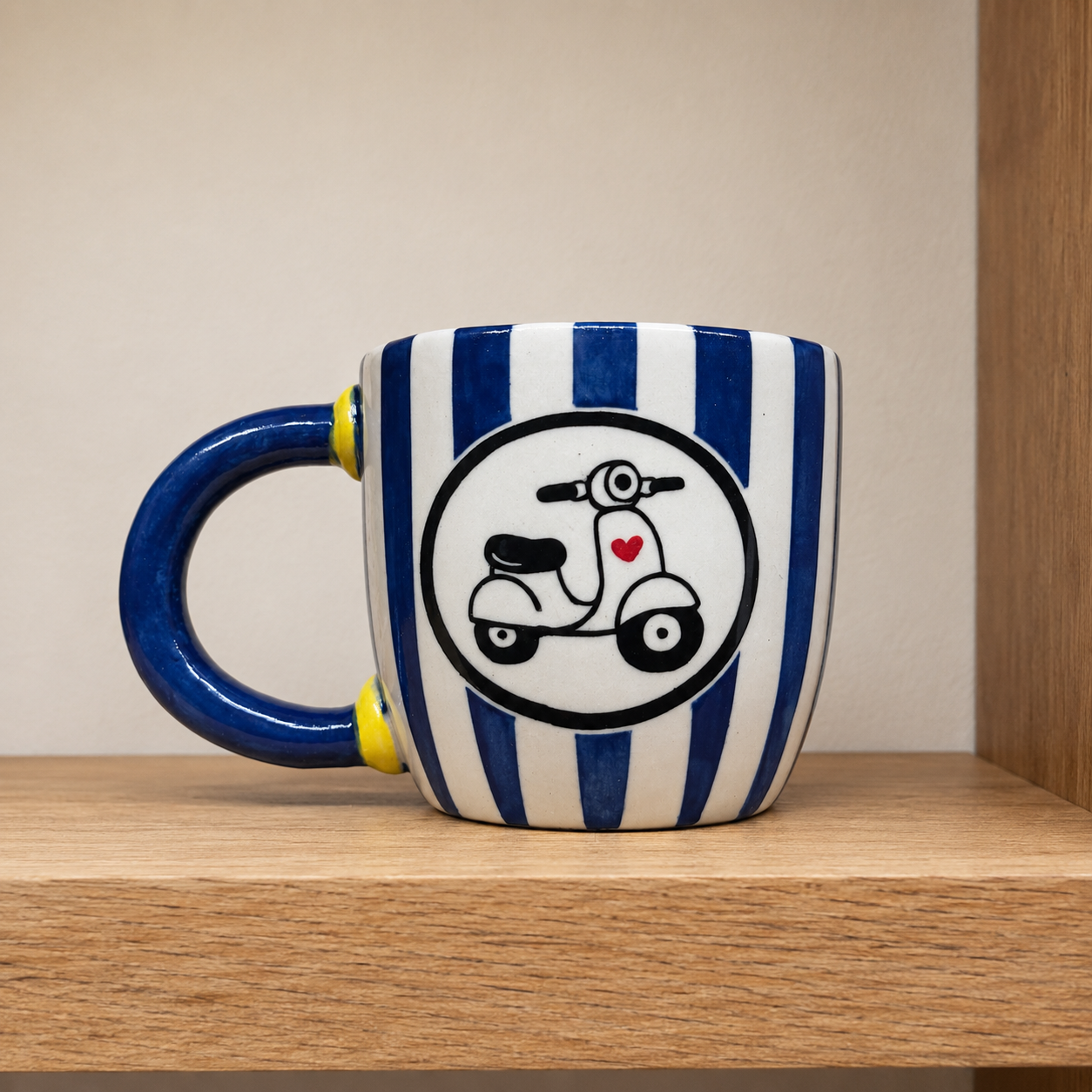 Hand-built mug with a hand-painted Vespa scooter design.
