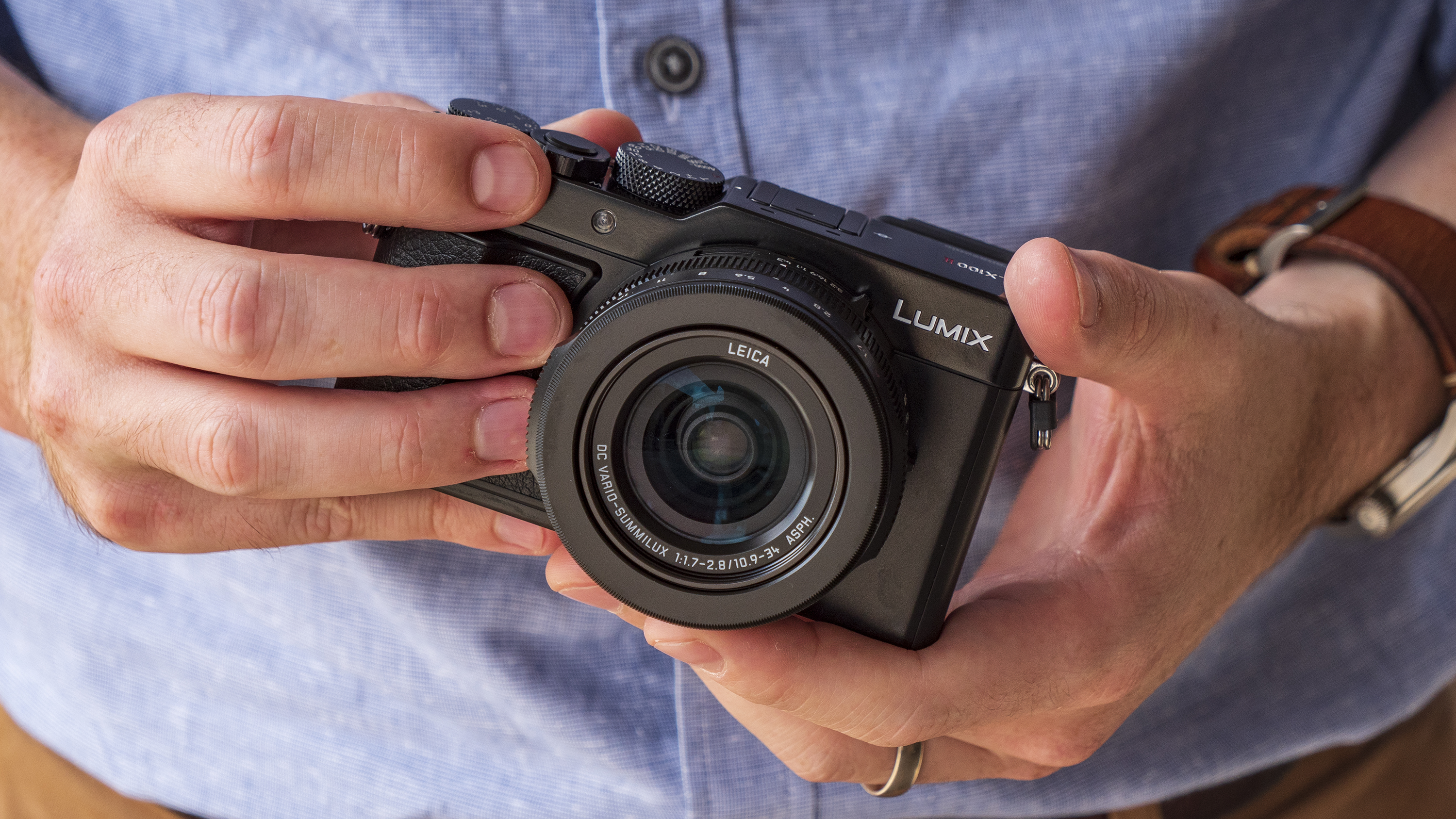 Panasonic Lumix LX100 II compact camera in the hand
