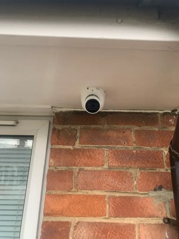 4K ultra HD security camera with clear daytime image quality showing a residential street