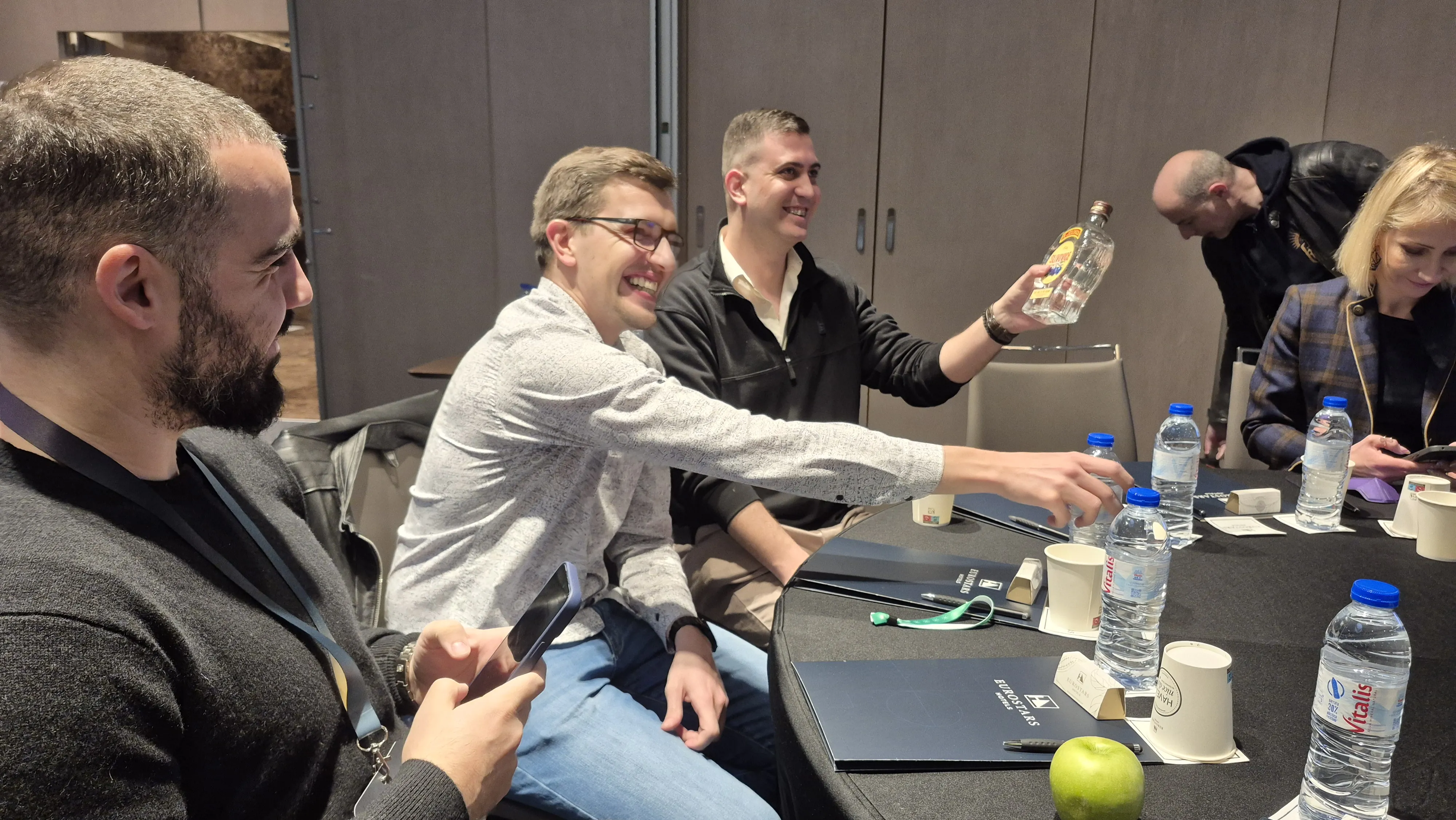 Candid table moment with IFT attendees laughing during a session break