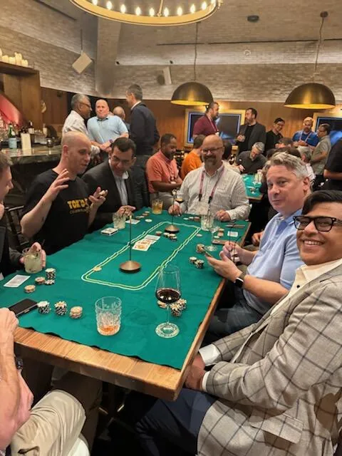 Corporate group around a poker table during a training session