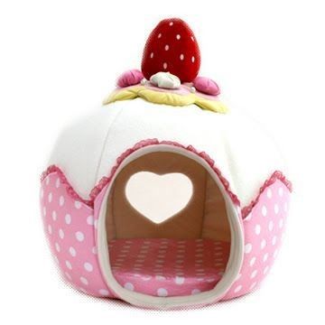 a cat bed shaped like a strawberry cake
