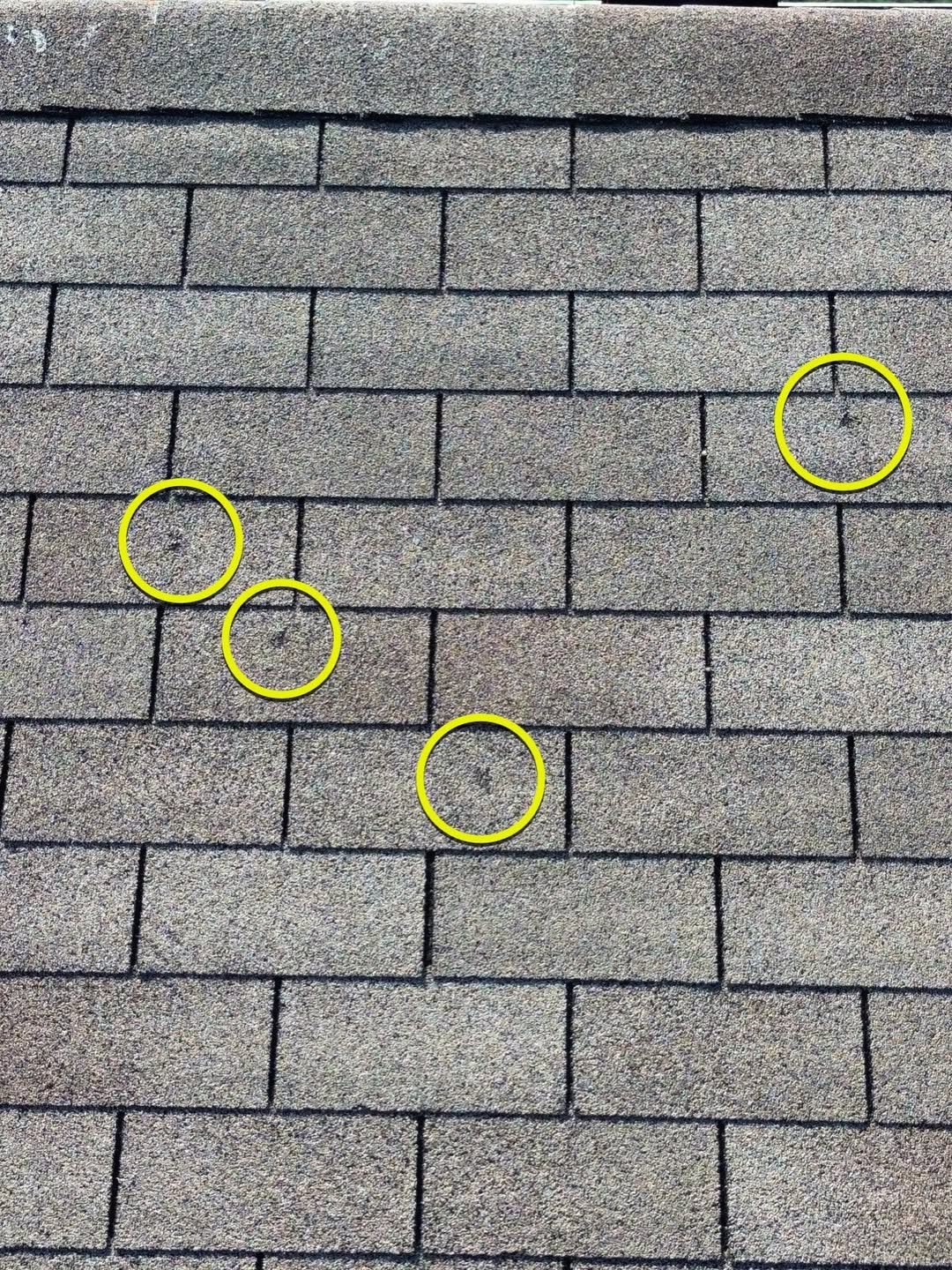 Roof shingles marked for hail damage
