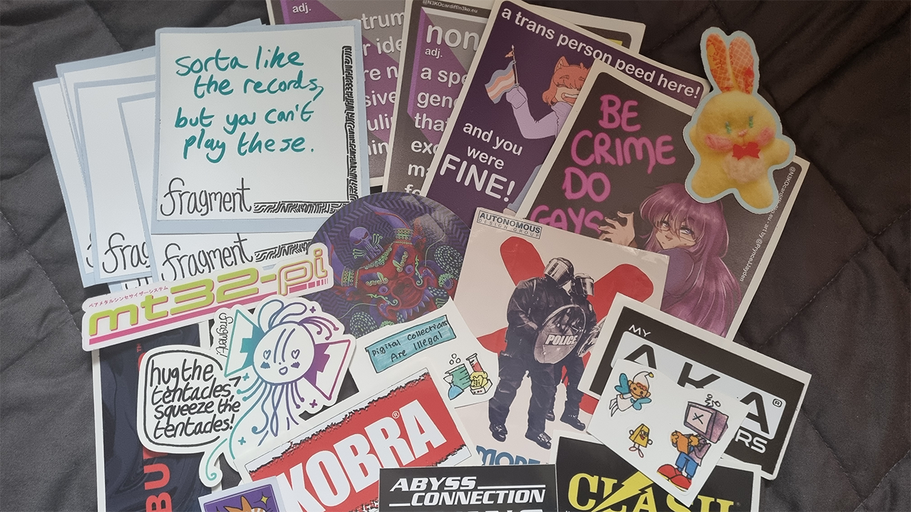 A variety of vinyl stickers with various colorful brand logos, characters and messages.