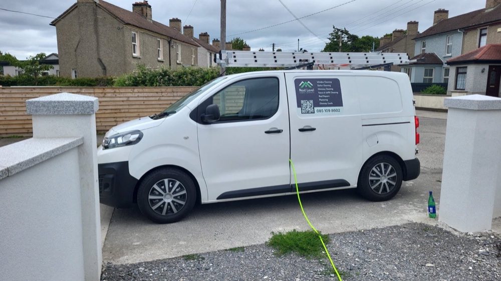 Next Level Property Maintenance branded van on a residential job