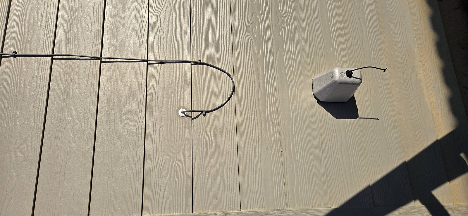 Outdoor cable run along a fence