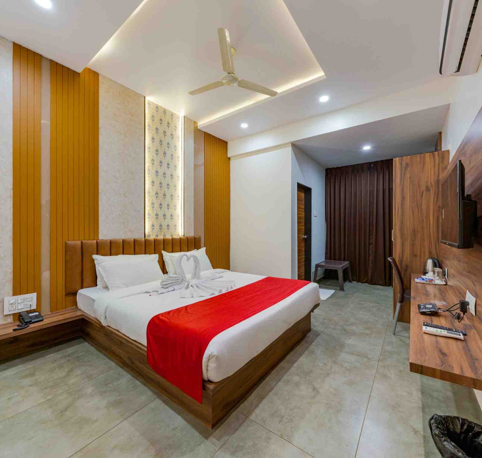 Actual guest room interior at Hotel Trisha Executive in Adamapur, Kolhapur; room category is shown in the card heading