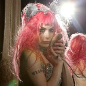 no pictures of him so i am using emilie autumn holding a rat because i modelled my self insert for him after her lol