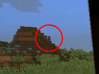 Herobrine in the distance standing on a hill with a big red circle