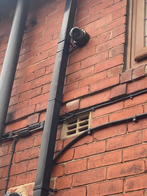 Security camera cabling and Ethernet cables running through a loft space during installation