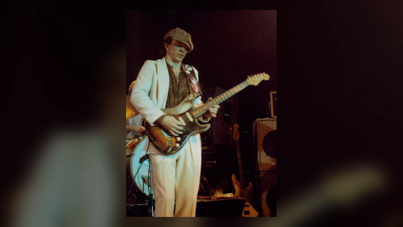 Stevie Ray Vaughan playing guitar onstage in 1983