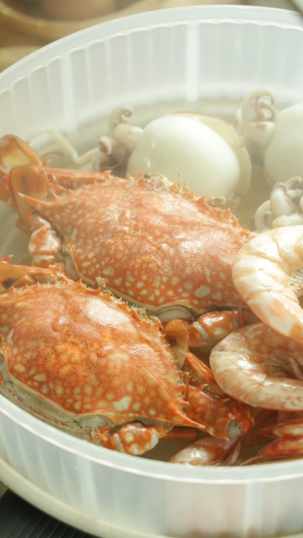 Steamed crabs shrimp and squid ready for Thai seafood feast