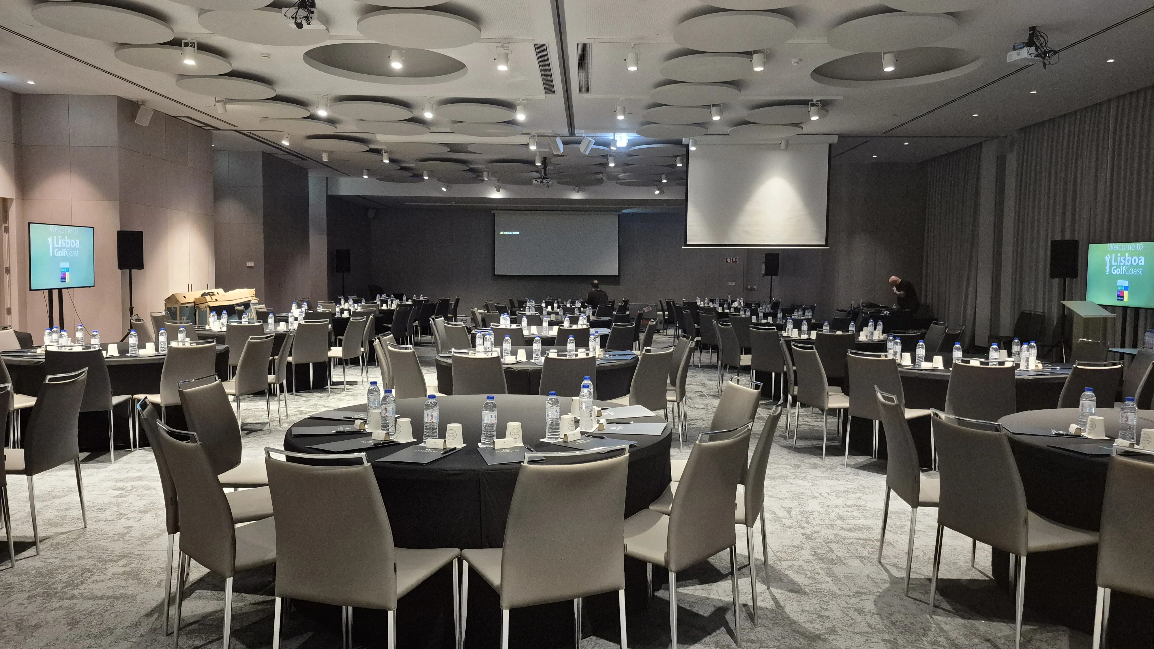 The empty IFT conference ballroom in Lisbon during evening setup before the event begins