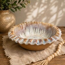 Hand-built bowl with a scalloped edge and hand-painted details.