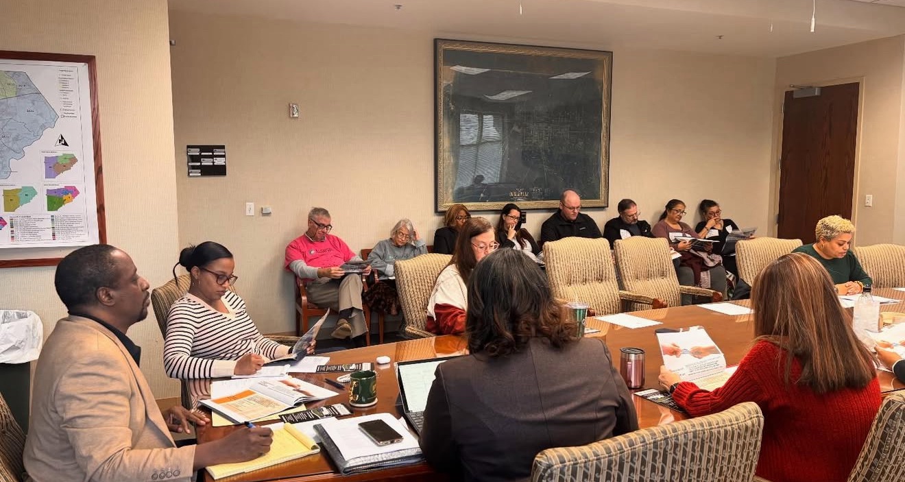 Community leaders in a planning session around the conference table