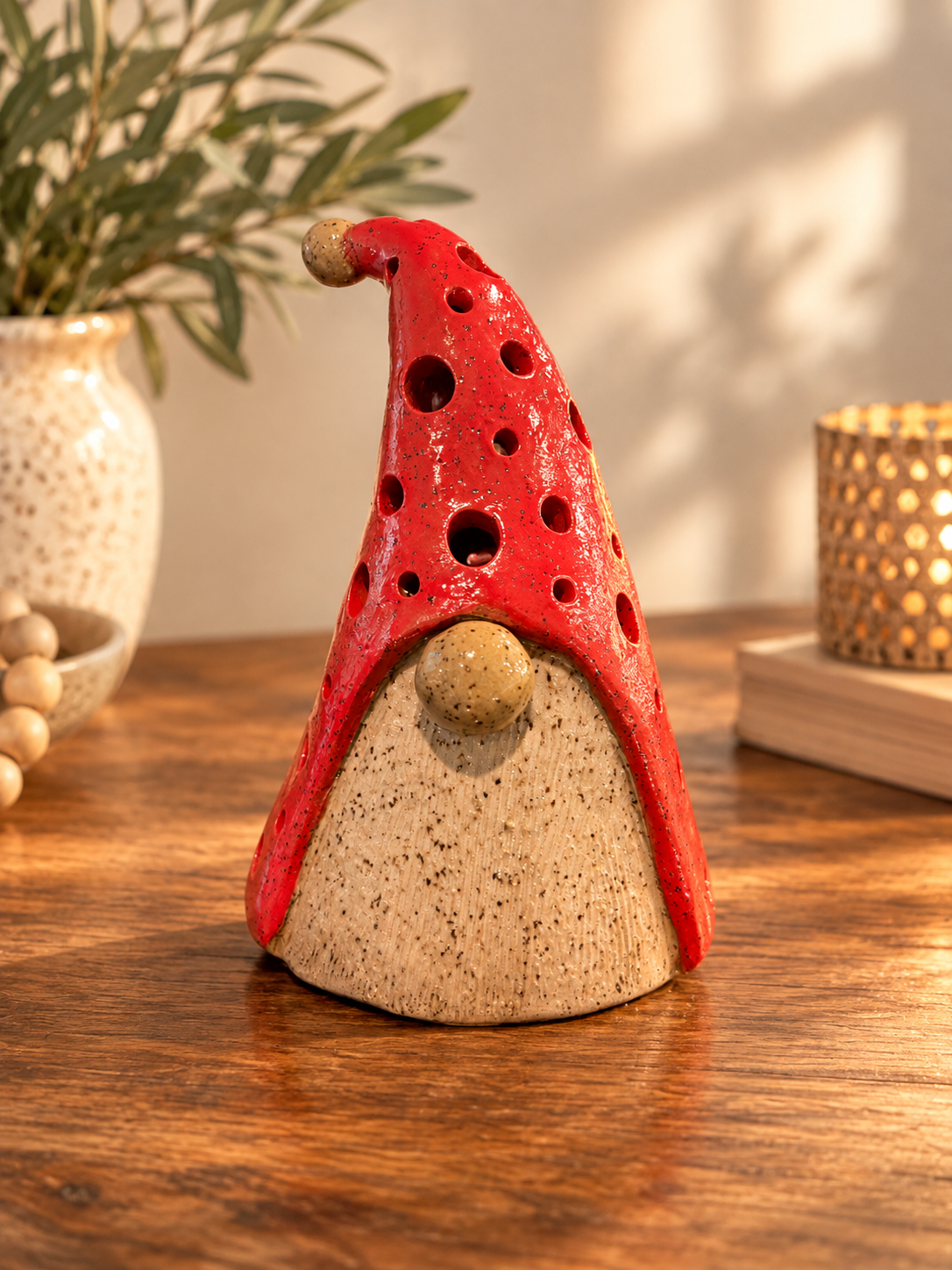 Hand-built gnome luminary in red with hand-painted details.