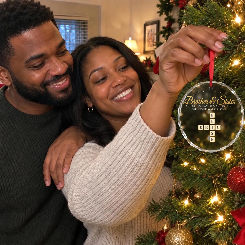 Brother and sister hanging their ornament