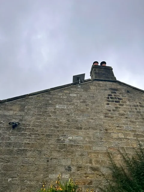 Smart doorbell camera installed at a UK front door entrance with two-way audio
