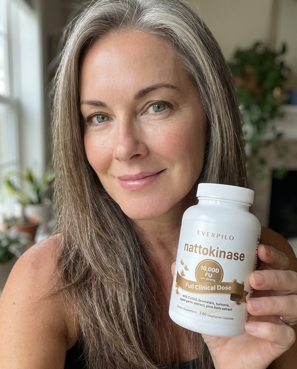 A verified Everpilo Nattokinase customer holding her bottle at home